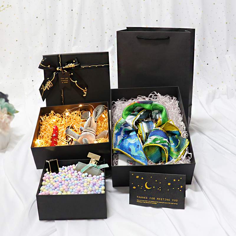 Elegante caja de regalo de cartón con lazo de cinta para perfumes y cosméticos 
